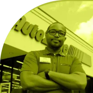 Person standing in front of auto parts store