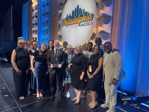 Greater Memphis Chamber team surround Chamber of the Year award in Philadelphia